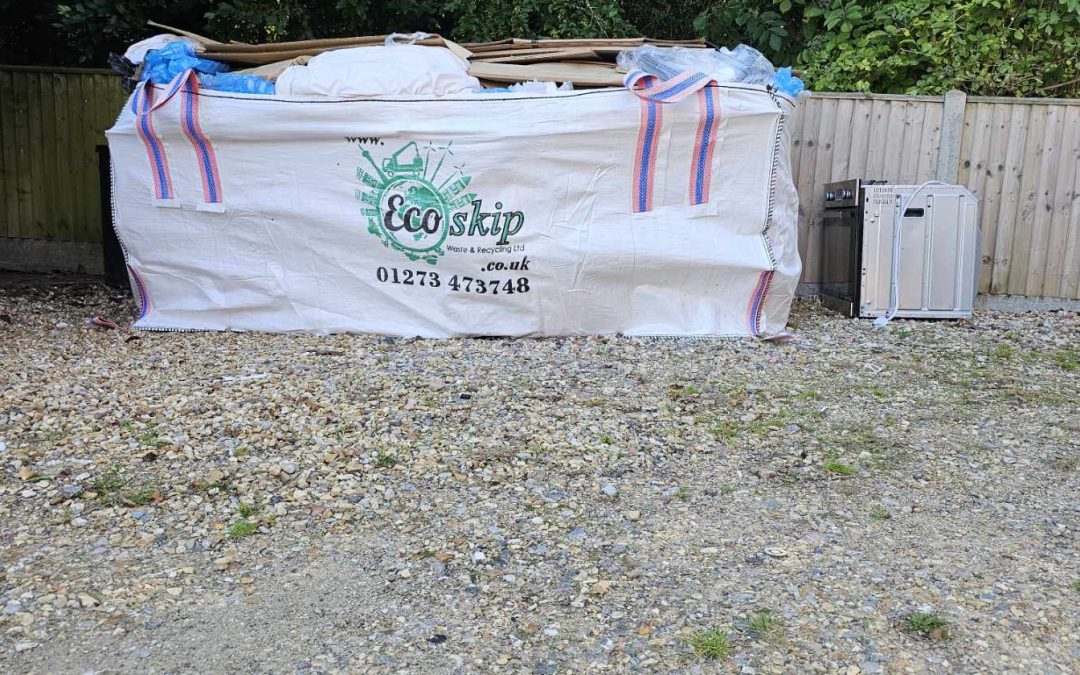 Full Eco Skip bag with waste, next to appliances.
